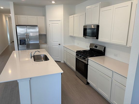 Island seating, open to living and dining