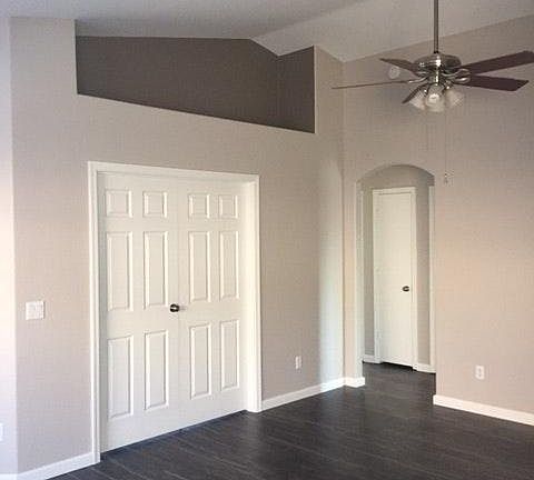 Living room with double doors to Bedroom
