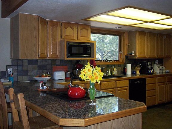 Plenty of counter space and oak cabinets. 