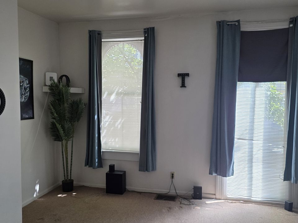 Spacious Living Room with big windows and lots of natural light.