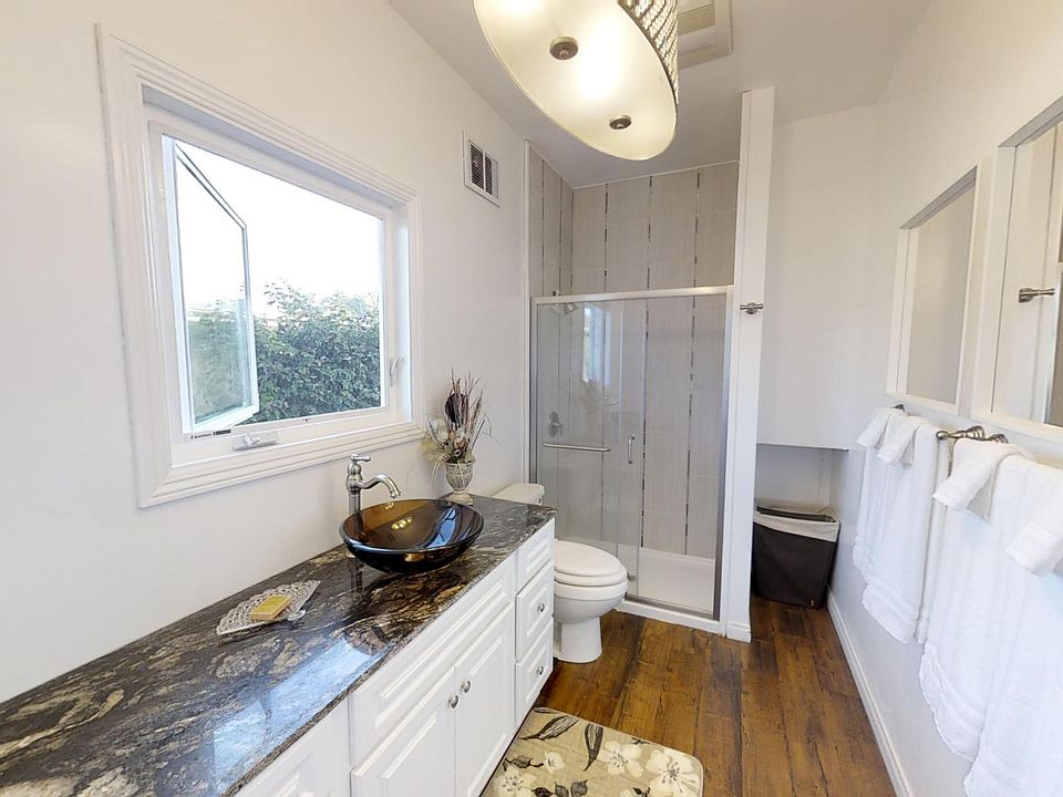 Master bathroom, granite counter with vessel glass sink.
