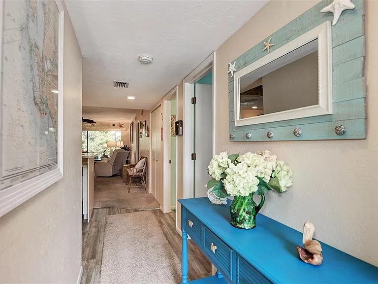Step into paradise. __ Our entryway is designed to give you that "ahhh" feeling the moment you walk through the door. Bright, clean, and perfectly coastal_it's the warm welcome you deserve for your Englewood getaway!
