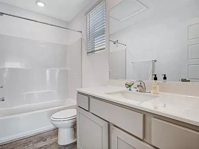 Secondary bathroom located directly across secondary bedroom.