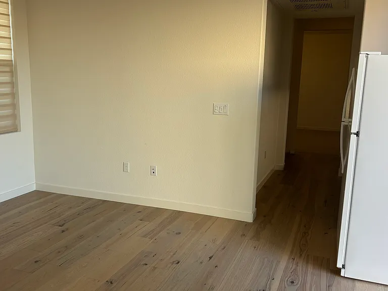 living room with refrigerator