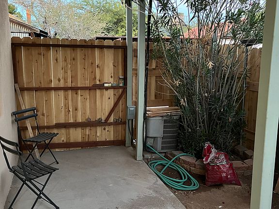 Interior of enclosed porch and small front yard