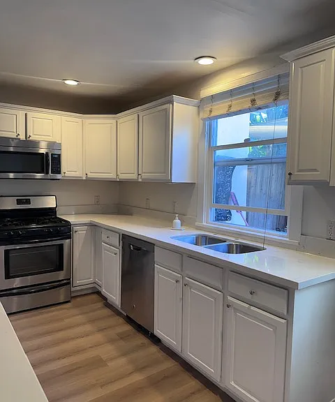 Brand new quartz countertops and sink and new vinyl floors