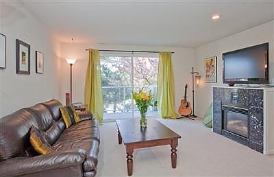 The focal point of the spacious living room is the gas burning fireplace with marble surround. The s