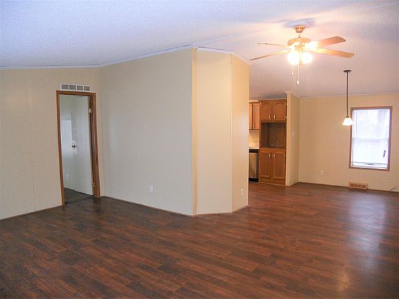 Spacious, open living space with separated kitchen and livin