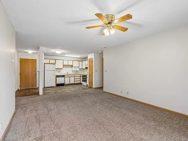 The spacious open living area flows seamlessly into the kitchen, creating a comfortable setting for everyday living and easy entertaining.
