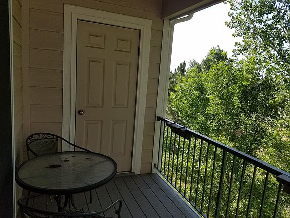 Balcony overlooking open space with extra storage closet.
