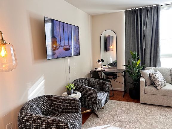 55 Inch TV. Comfortable seating & desk