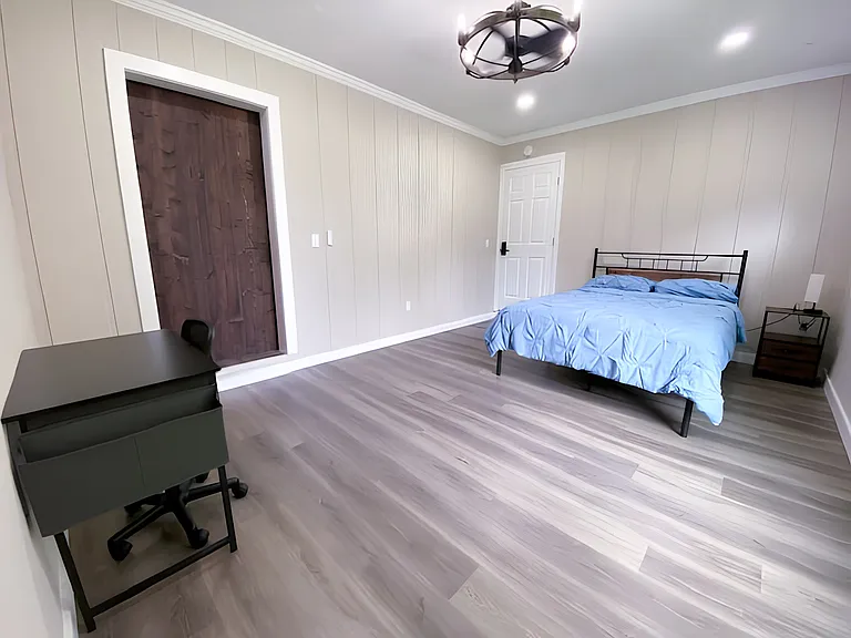 Orange room - extra large room with large walk-in closet. Very spacious with chandelier with fan, desk, stool