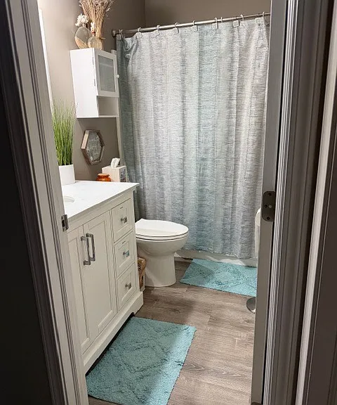 Hall bathroom with shower & tub.