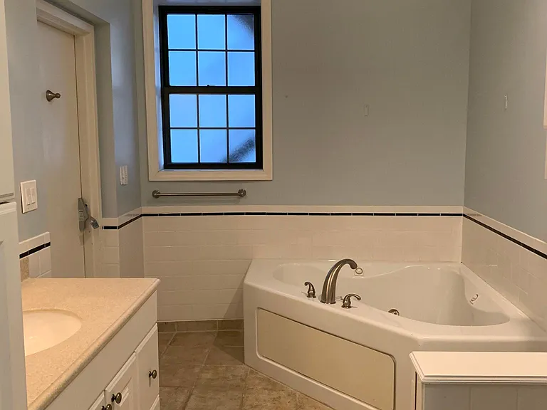 Master bath with shower and jacuzzi tub.