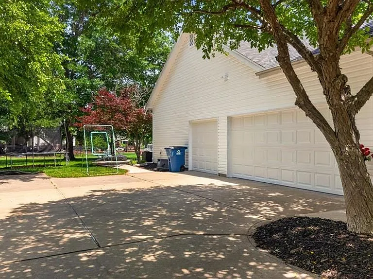 Concrete driveway offering ample parking