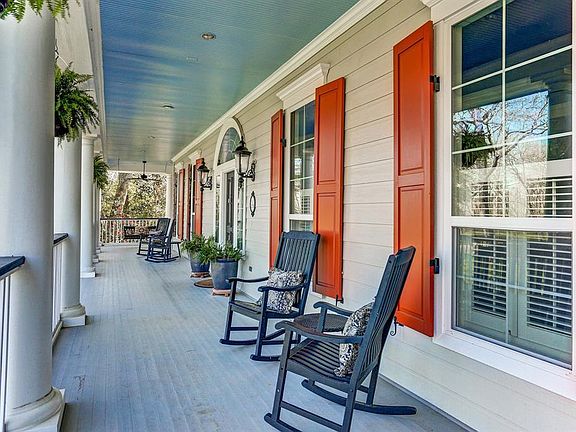 The impact of this elegant home is felt from the moment you see the beautifully finished front porch. The columns and southern design set it apart but the elevated foundation and antique brick finish make this home truly distinct