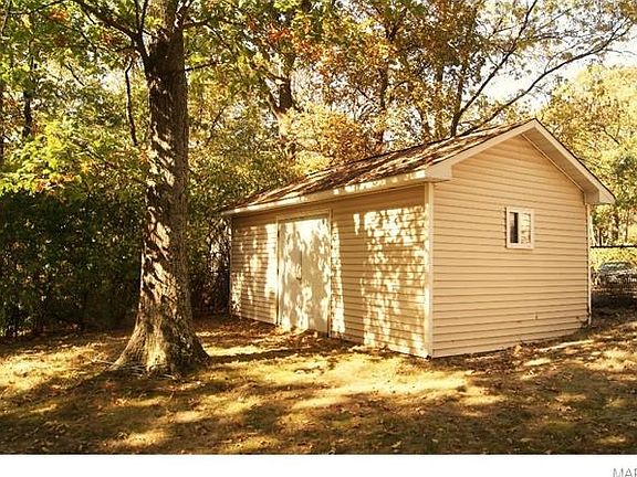 Outbuilding has all the space for storing patio furniture and entertainment equipment