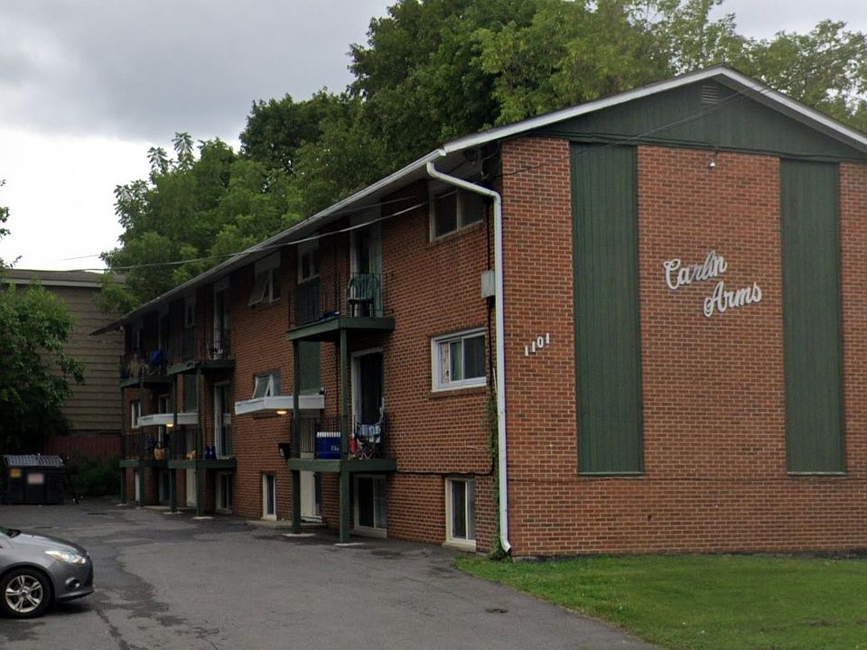Exterior of apartment building and parking lot
