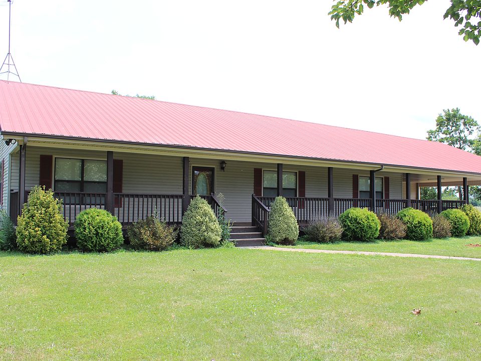 View of front. Shrubs scheduled to be trimmed.