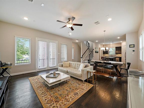 Living room, dining rom and kitchen are open for easy living and entertaining! French doors let in lots of natural light and fresh air. Tall ceilings and solid oak hardwood floors. Comfortable space because one of the two smart Ecobee thermostats.