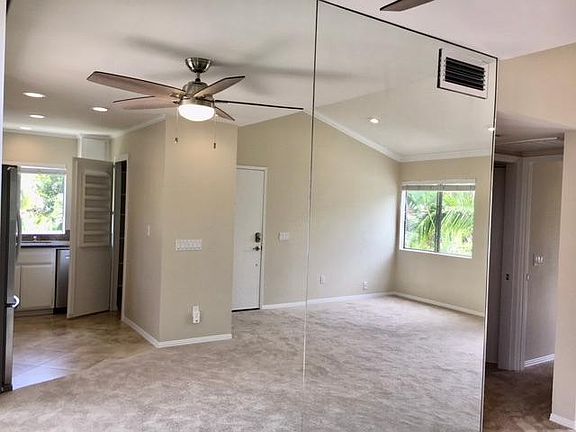 Living Room with view of the Kitchen from the Dining Room mirror