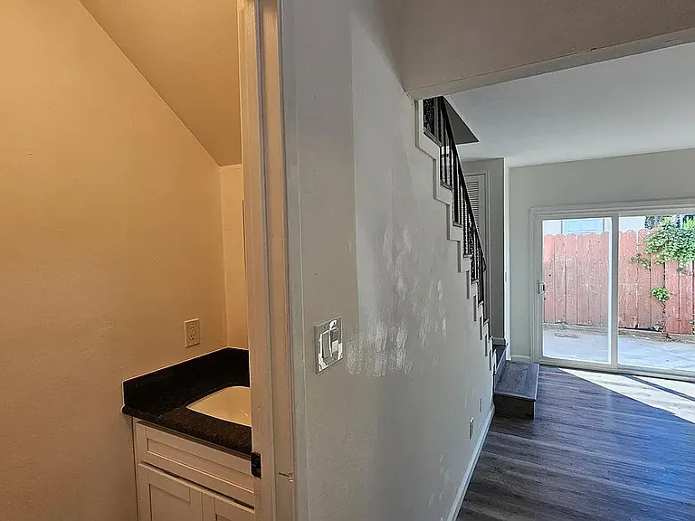 Downstairs half bath , with the patio in background