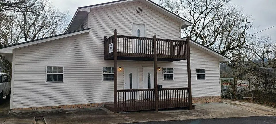 Front View, Vinyl siding on a slab. each apartment has it's own HVAC system and the landlord takes care of the filter changes and maintenance of these systems. There are 3 apartments, but only the 2 on the ground floor are currently available. Parking