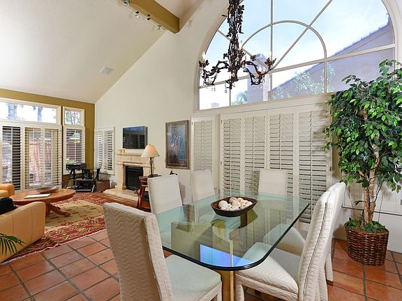 Open concept floor plan with dining and living room opening