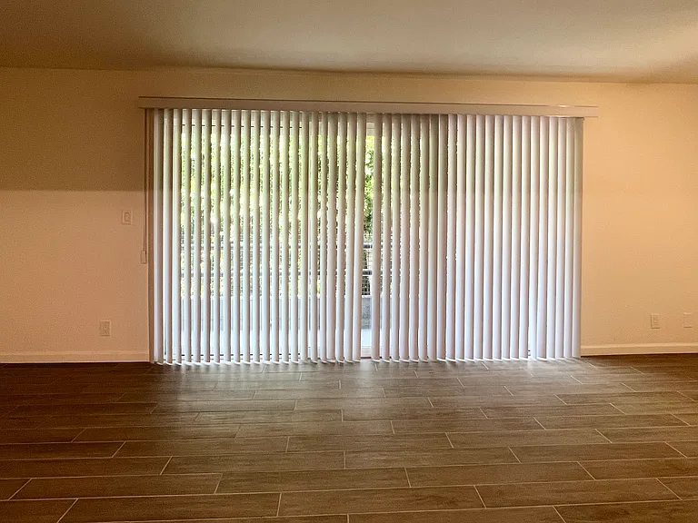 Living Room Area w/tile flooring & access to the balcony