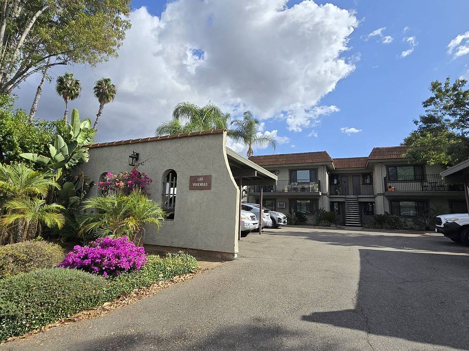 This well-maintained complex offers privacy with fenced sides and plenty of parking. The open entrance provides easy access while maintaining a tucked-away feel. Residents enjoy assigned parking in a secure lot, keeping vehicles off the street.