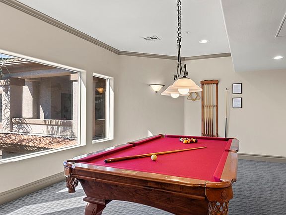 Community pool table on the 3rd floor next to the elevator