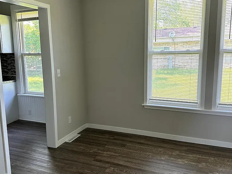 Living room; windows overlook side yard