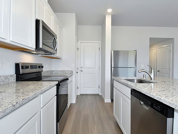 Each kitchen features stainless steel, upgraded appliances.