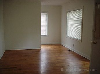 View of living/dining room area with hardwood floors