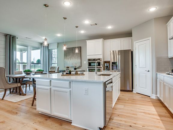 Model Representation - Island kitchen open to dining and living areas