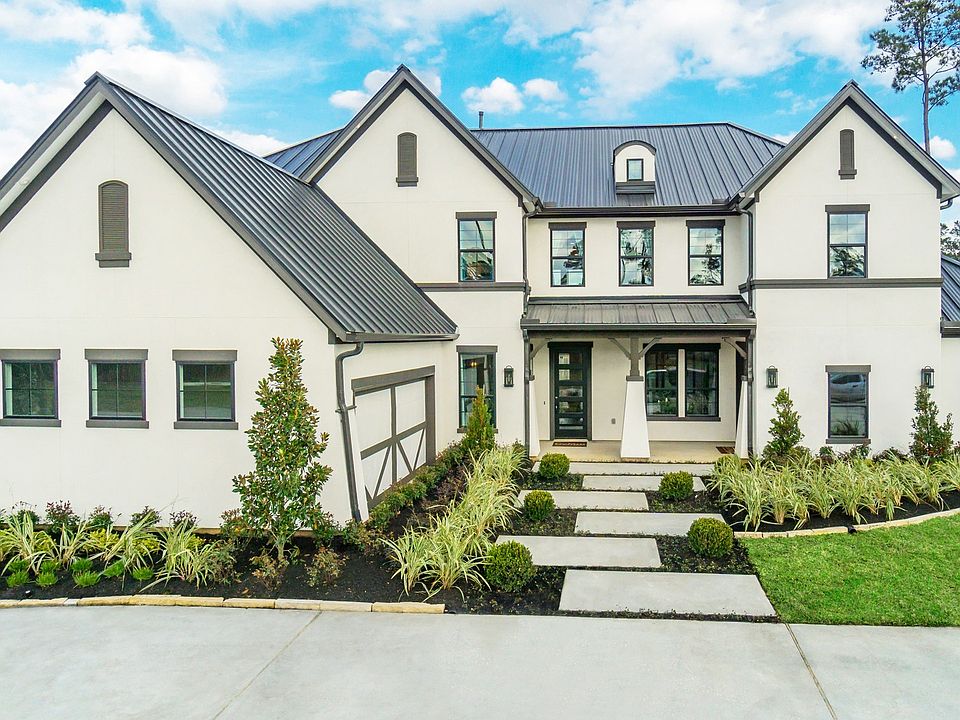 Experience refined living in Mostyn Manor Reserve with sleek white exteriors and a contemporary blac