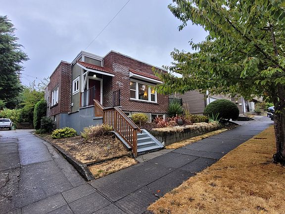 Front of House and Sidewalk w/ side driveway