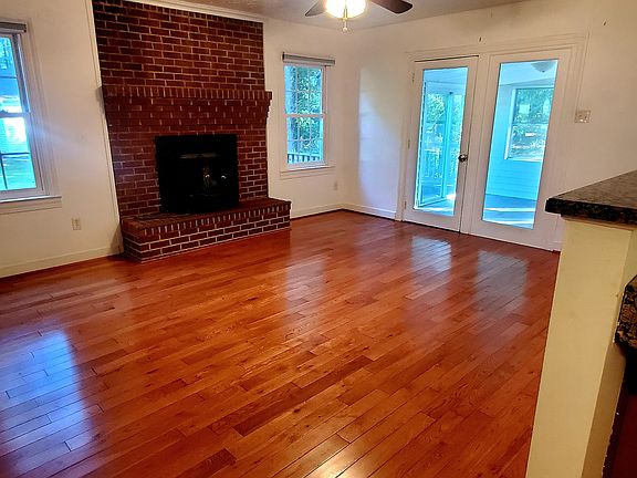 Family room with woodstove insert, off of the kitchen with sunroof to the right