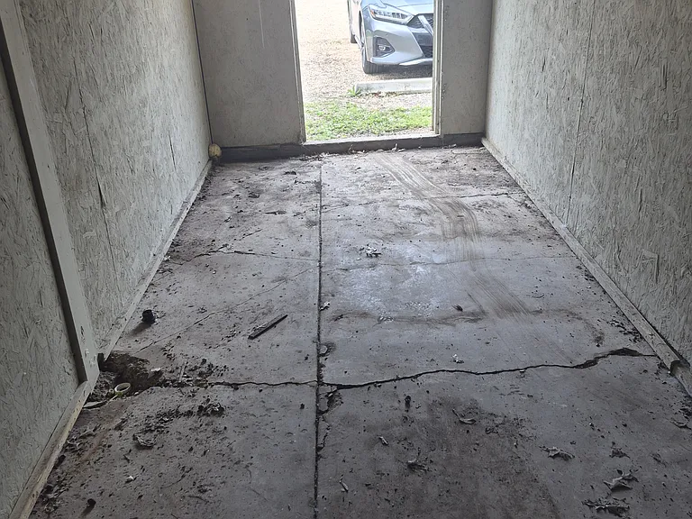 Inside storage unit looking out toward parking lot.