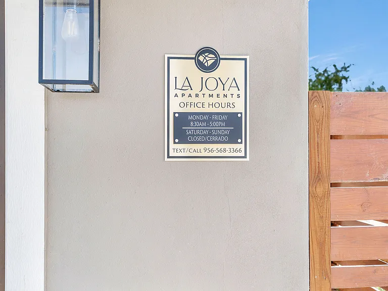 La Joya Apartments in Laredo, Texas, featuring office hours and contact information for inquiries
