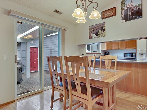 Dining area w/ slider door access to backyard.