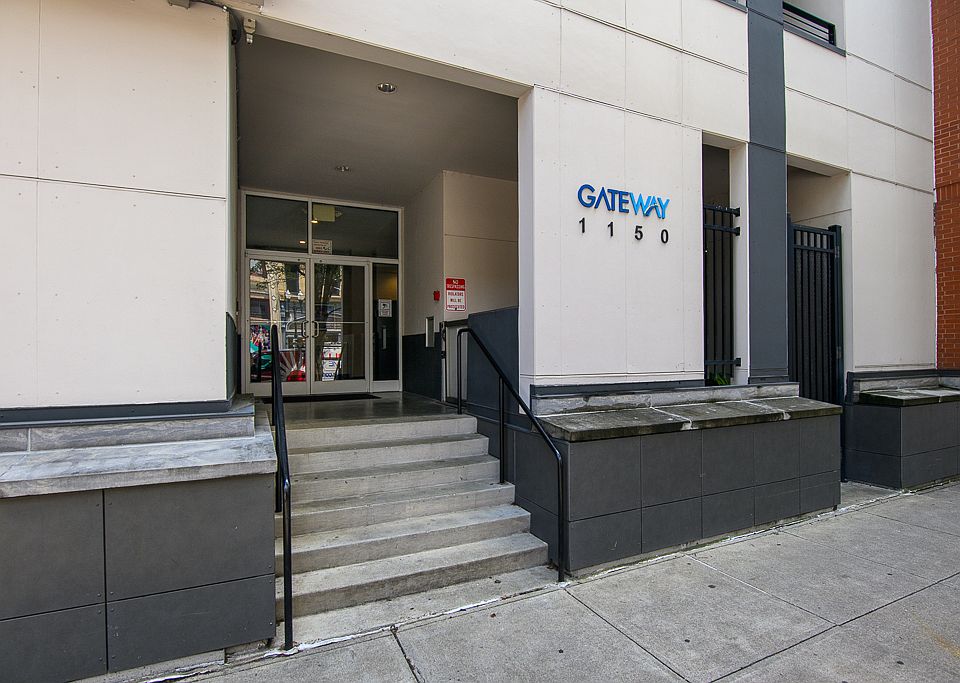 Main entrance to building with wheelchair entrance to the right.