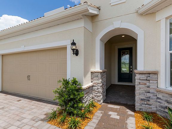 Covered entryway with decorative glass front door