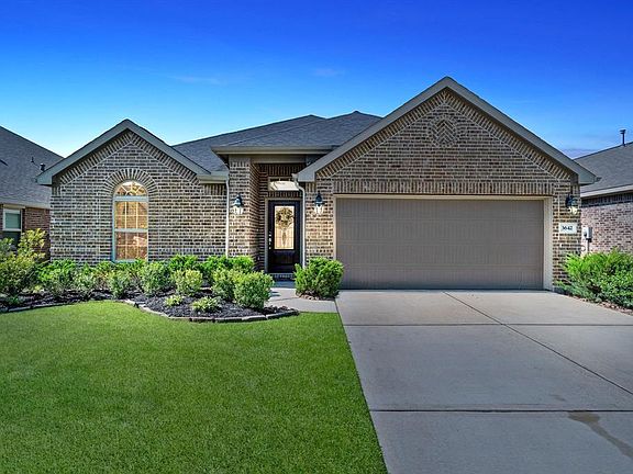This home is well lit with 3 coach lights adorning the front of the home and an overhead porch light.