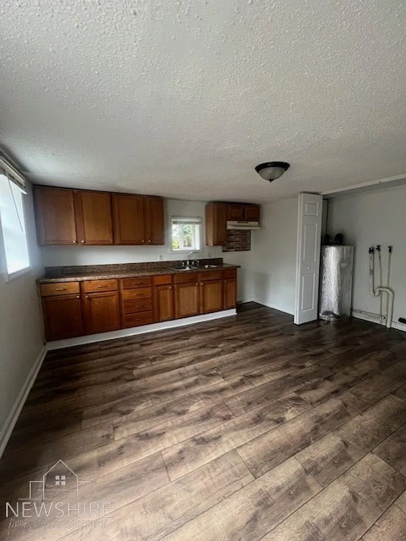 Charming 2BR Home with Large Front Porch & Spacious Kitchen — Photo 2