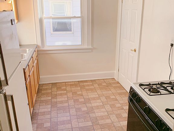 Large eat in kitchen with Gas stove, oven, refrigerator, and pantry.