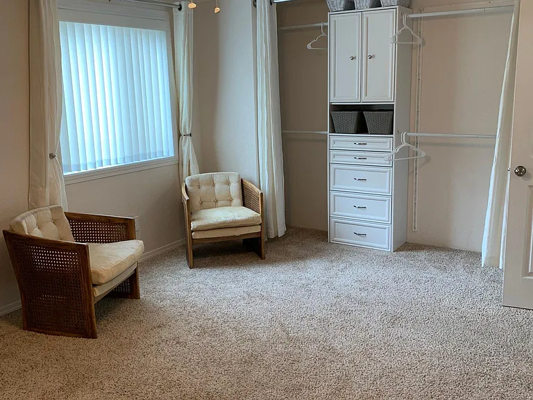 Closet organizer can have 4 hanging rods or 2 rods and 5 shelves, to tenants satisfaction. Wall to wall carpet. 2 end of bed sitting chairs.