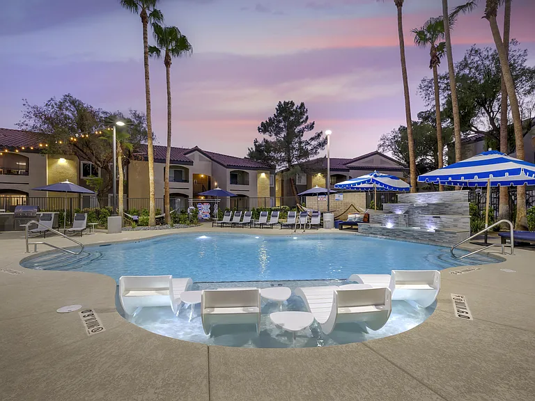 As twilight descends, our renovated pool transforms into a magical oasis, beautifully illuminated by soft, ambient lighting.