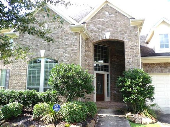 Covered porch, three car tandem garage!