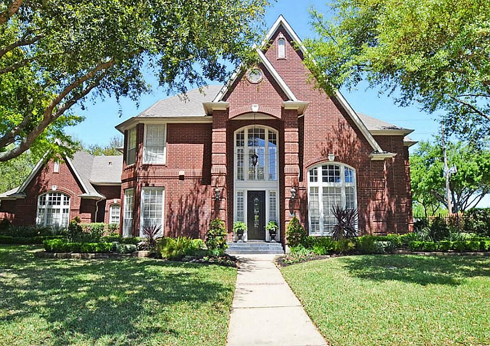 GORGEOUS CURB APPEAL ON THIS CUSTOM 23,000+SQ FT PRIVATE CORNER LOT BACKING TO A GREEN BELT